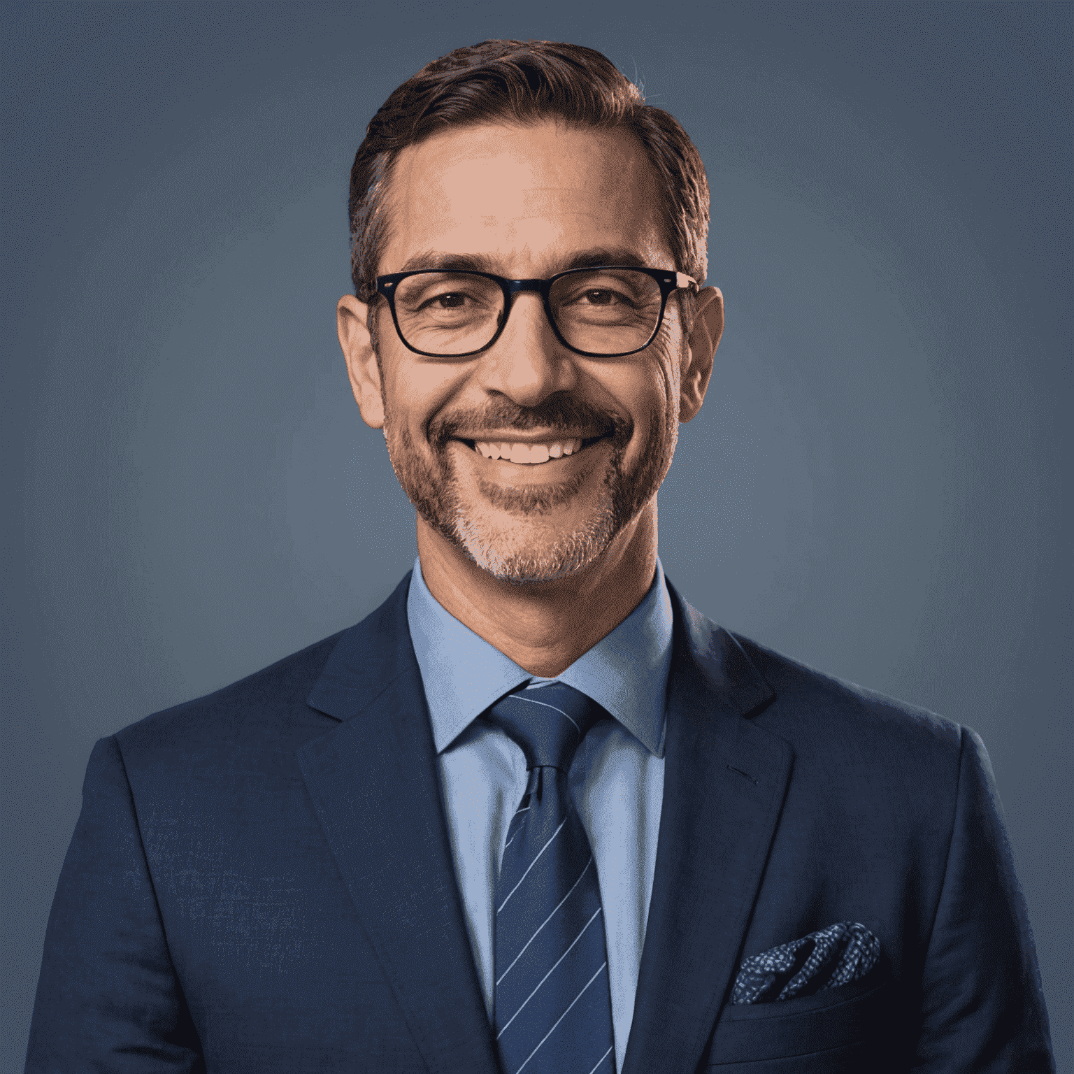 Jose Graham, founder of PurelyCrafted - A middle-aged man with short dark hair and glasses, wearing a navy blue suit, smiling confidently at the camera